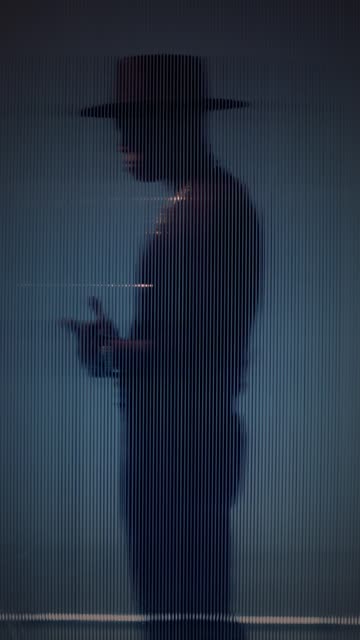 Male Model Seen Through Acrylic Window.