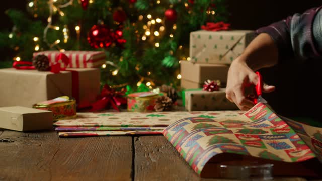 Hands Cutting Wrapping Paper.