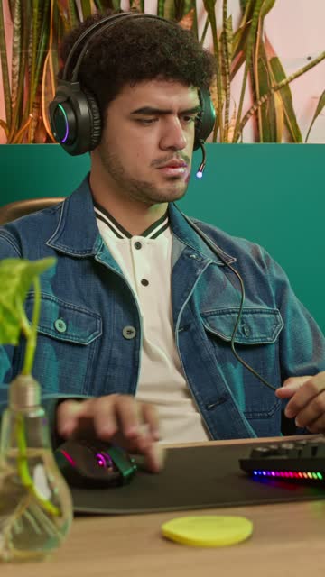 Smooth Pan of Focused Man at Desk.