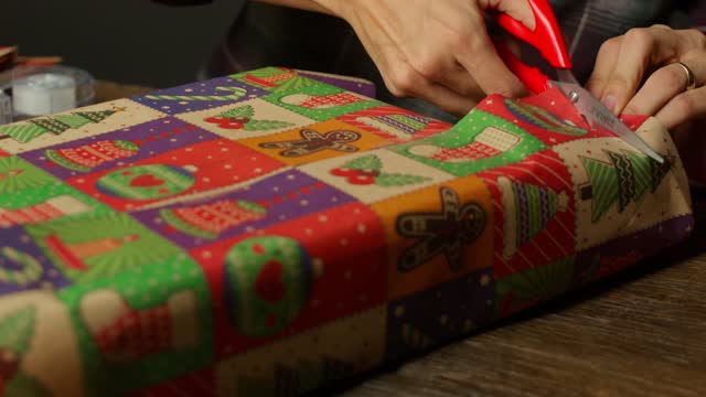 Hands Folding Wrapping Paper Corners.