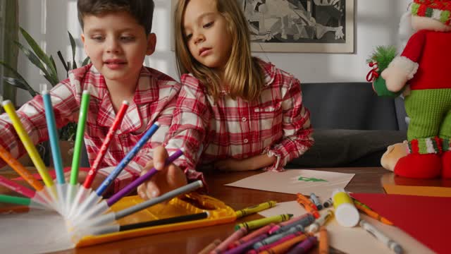 Siblings Making Colorful Drawings.