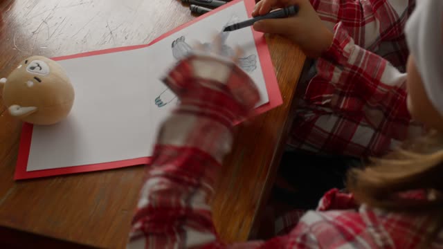 Siblings Preparing Their Santa Letter.