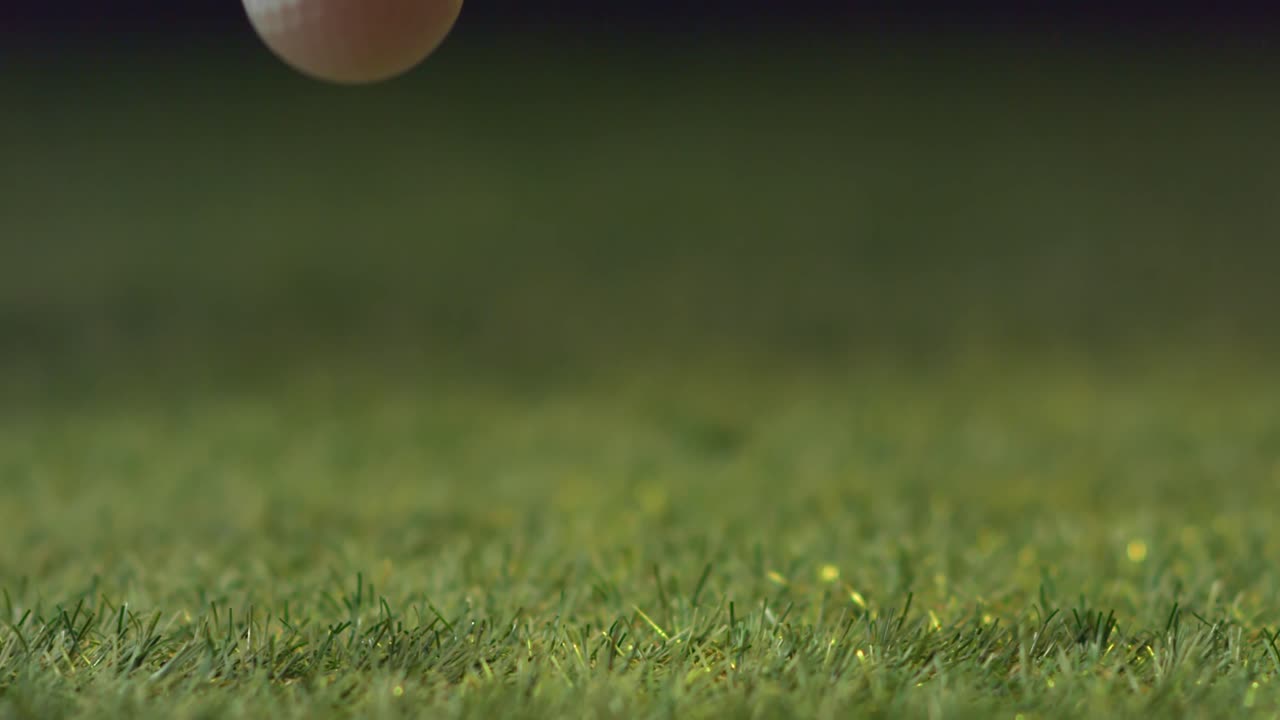 Golf Ball in Mid-Air Bounce Over the Green - Free Stock Video
