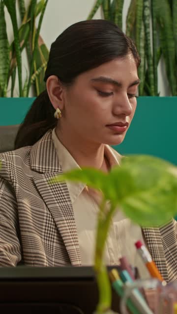 Indian Woman Working at Desk.