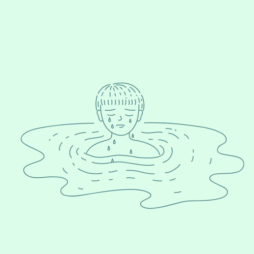 Person crying as their tears forming a puddle of water around them
