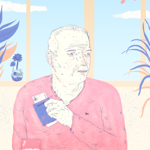 Elderly man sitting at a table holding his passport