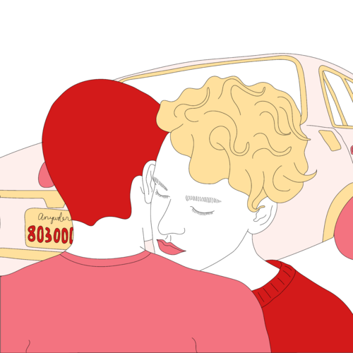 Couple embracing in front of a car