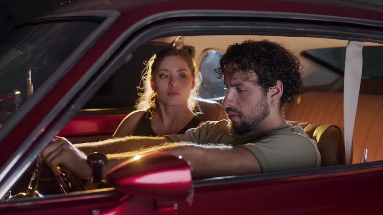 Tender Couple Moment in Retro Car.