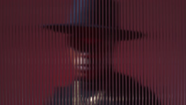 Model in Western Fashion Seen Through Acrylic.