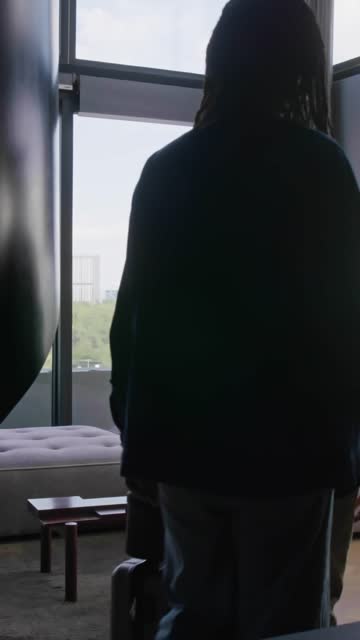 Couple Dropping Onto Couch.