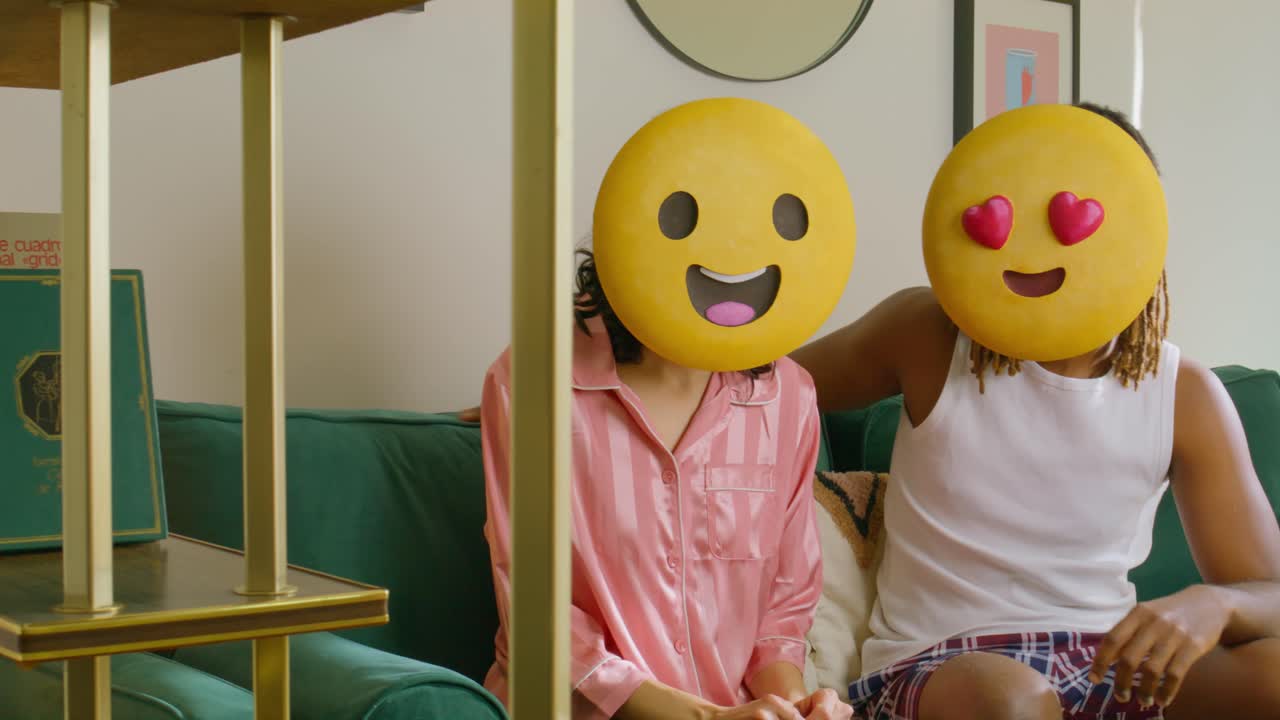 Emoji-Faced Couple Happy on the Couch.