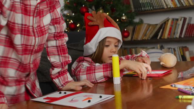 Boy and Girl Making Christmas Crafts.