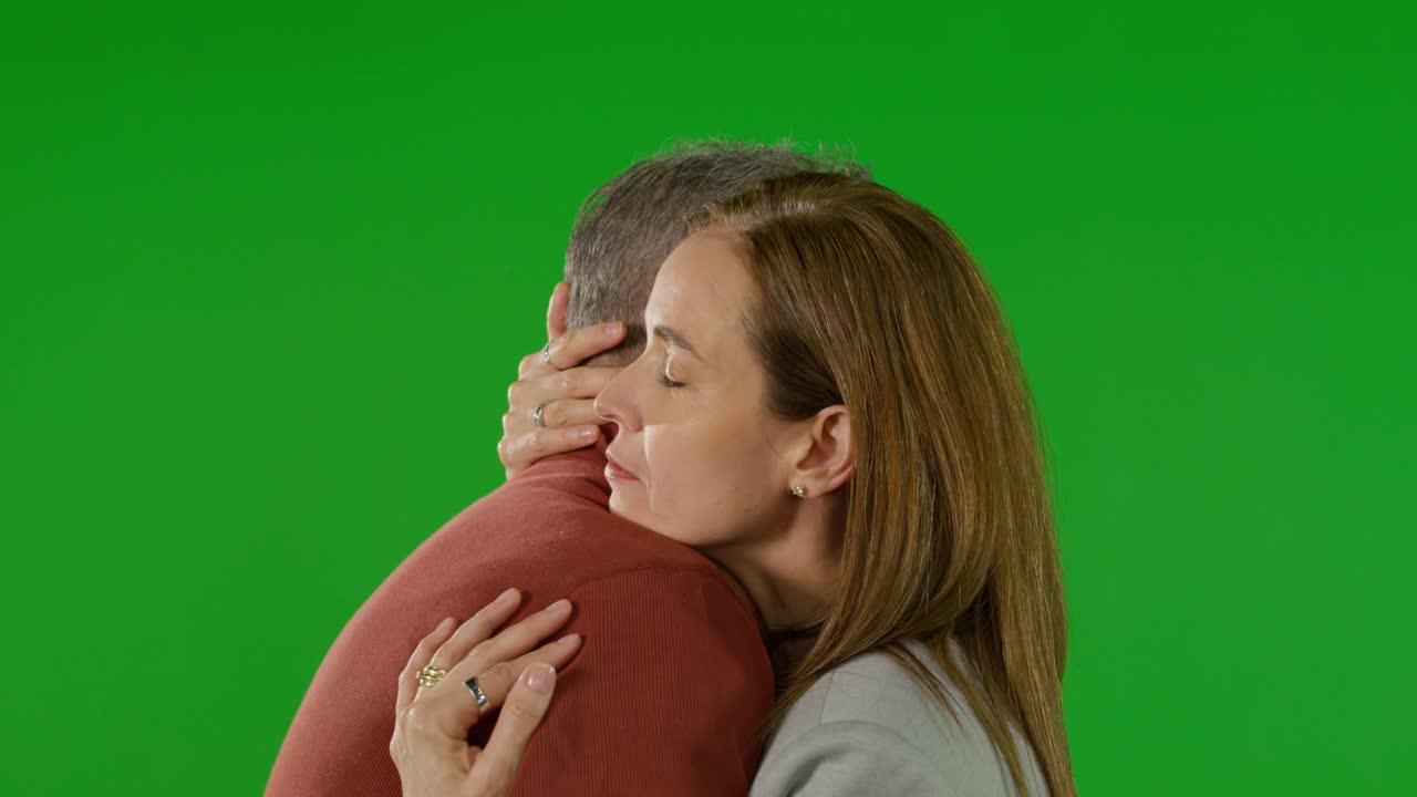 Mature Couple Hugging on Green Screen Backdrop - Free Stock Video