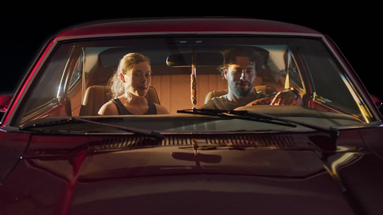 Couple Having a Chat in Vintage Car.