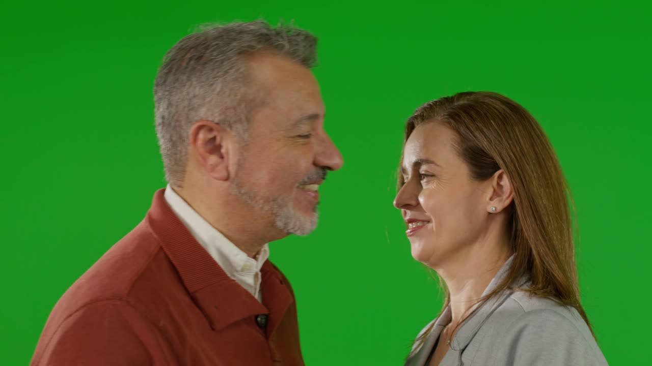 Warm embrace against a green screen background - Free Stock Video
