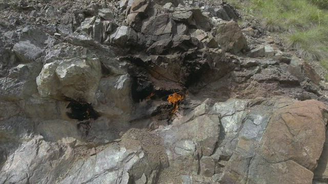 Flames burning in the rocks of the mountain.