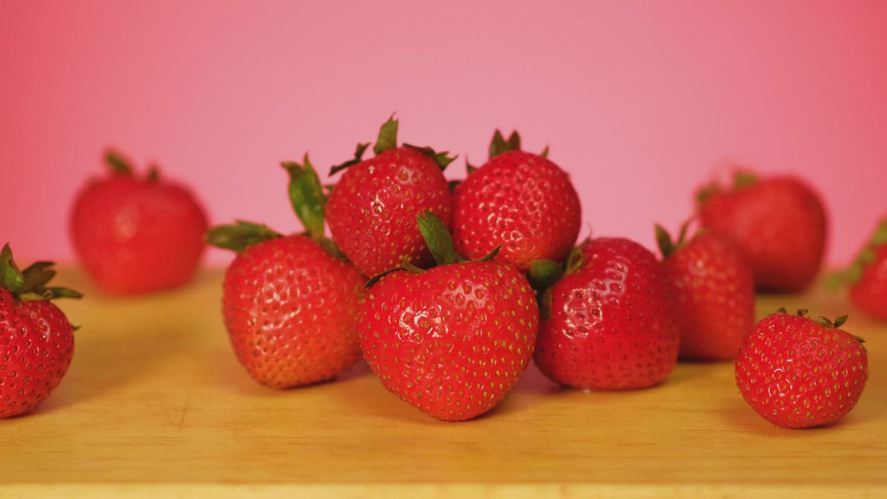Strawberries are covered in chocolate on a pink background - Free Stock ...