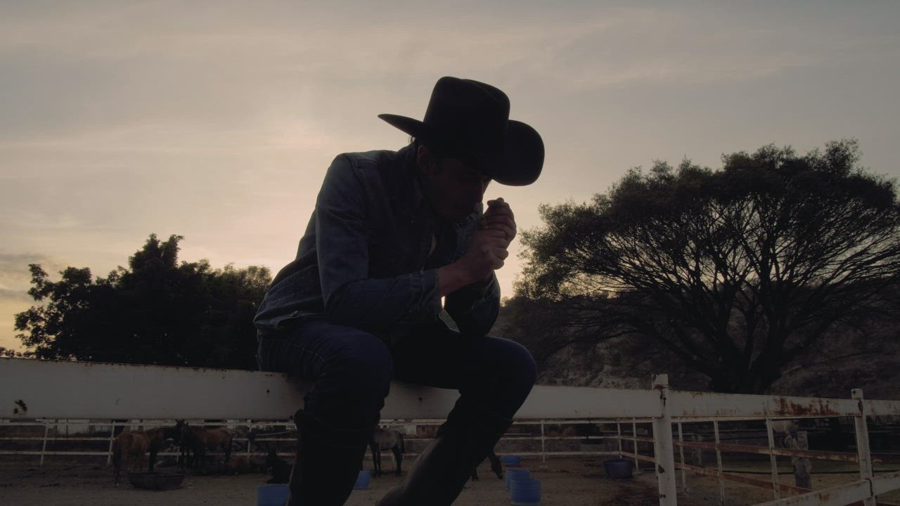 Rancher smoking at sunset - Free Stock Video