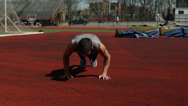 Man doing push ups quickly.