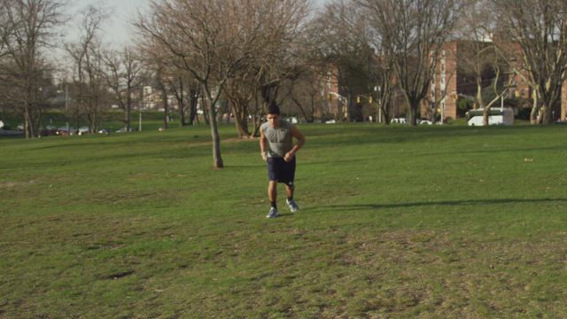 Man checking his phone while jogging.