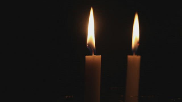 Thin candles burning.