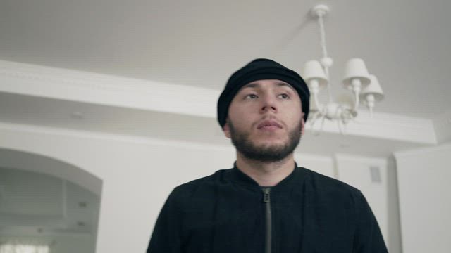 Thief pulls on balaclava and looks around.