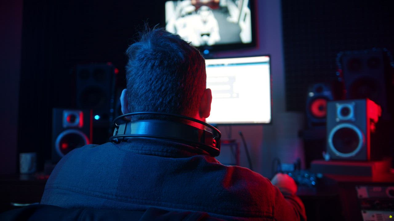 Sound Engineer working on a recording studio - Free Stock Video