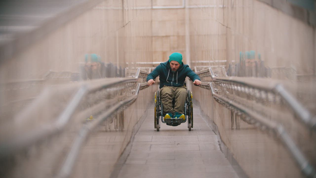 Disabled man struggling to go up the ramp - Free Stock Video