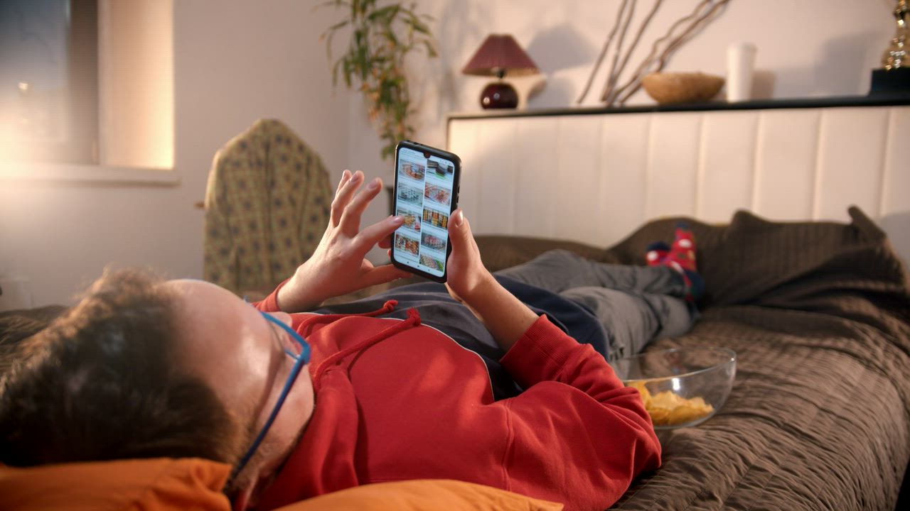 Man relaxing with phone