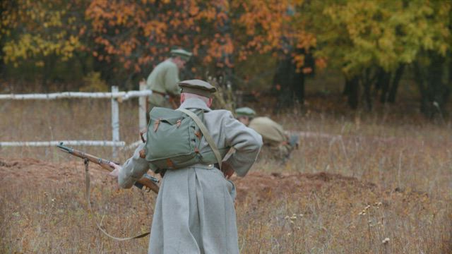 A soldier running on the battlefield.