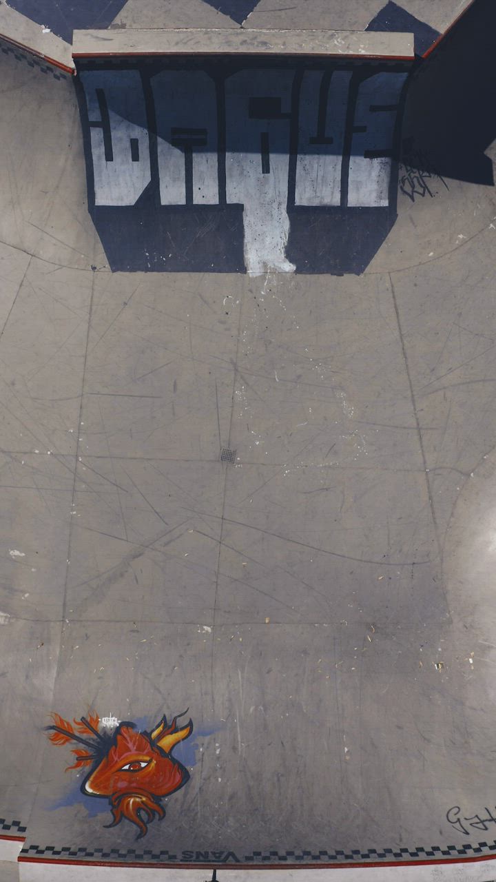 Top aerial shot of a skater skating on a half pipe - Free Stock Video