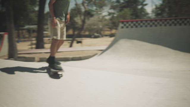 A young man skating in the park.