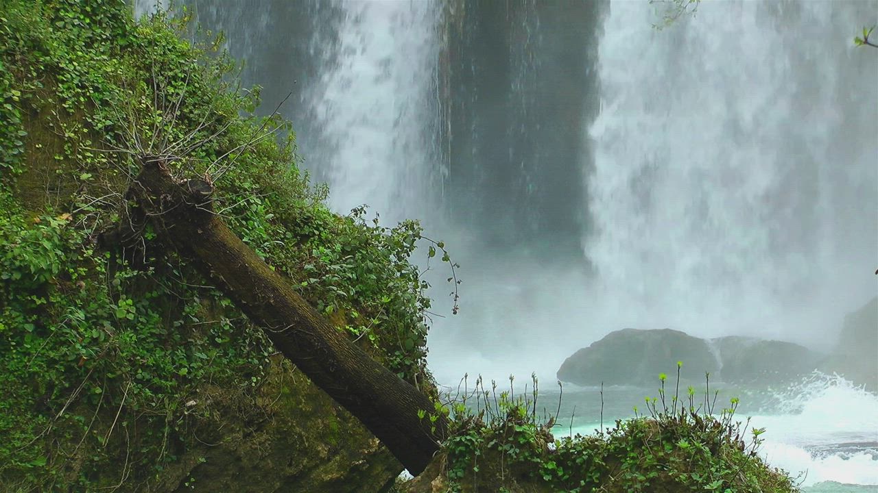Waterfall behind the rocks - Free Stock Video