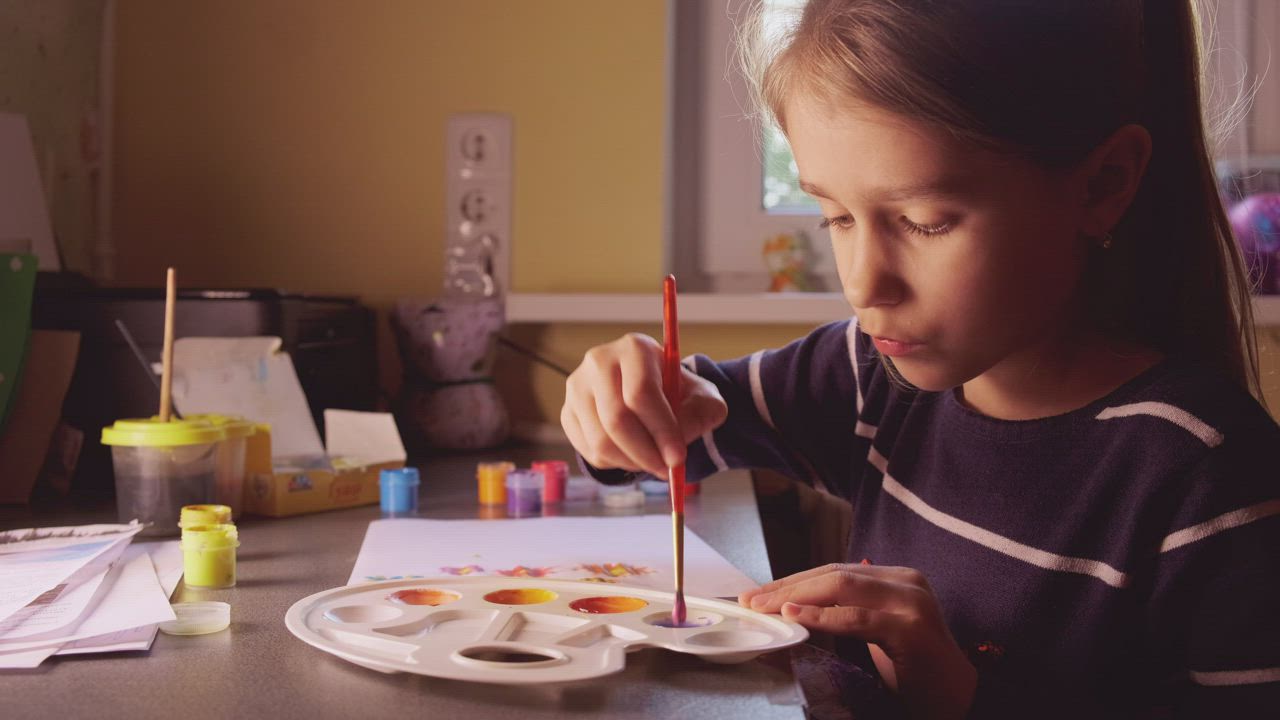 Little girl painting with watercolors at home - Free Stock Video