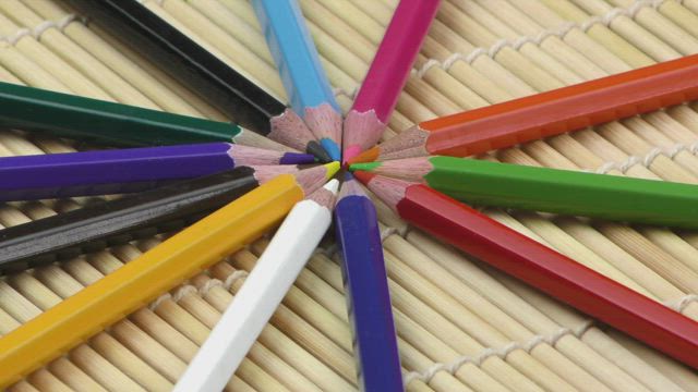 Colored pencils joined by the tips.