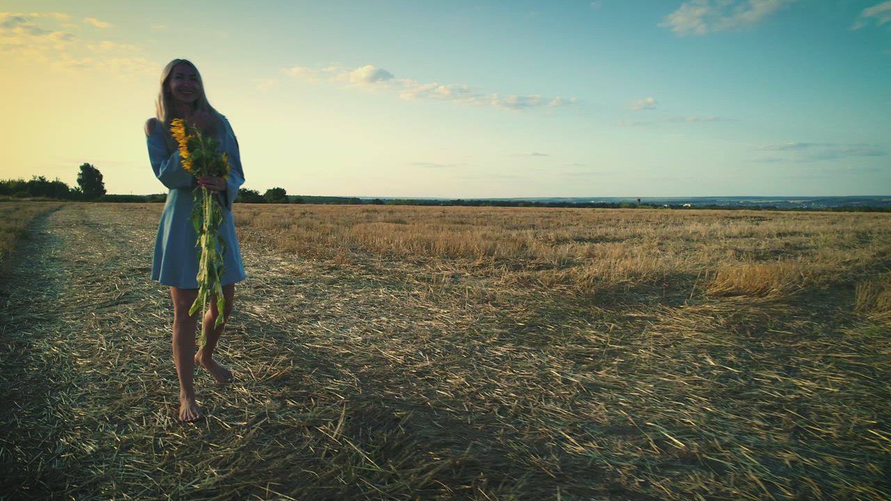 Happy woman in the field with sunflowers and a blue dress - Free Stock ...