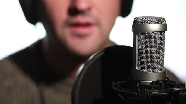 Man using a microphone.