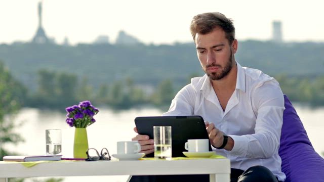 Browsing the internet outside.