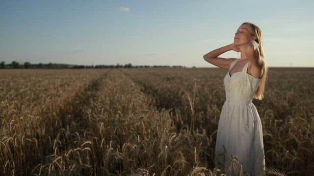 Young woman relaxing in a field.