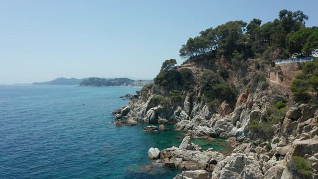 Rocky coast against a blue sky.