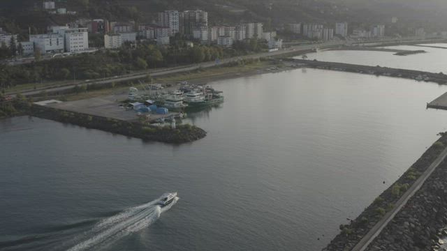 Boat arriving at a harbor.