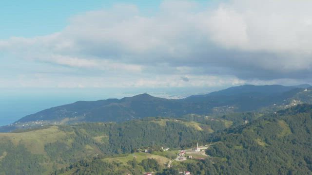 High above the hills.