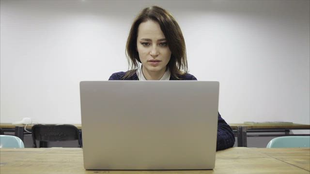 Exhausted woman working late.