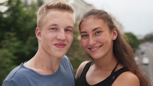 Man and woman laughing together.