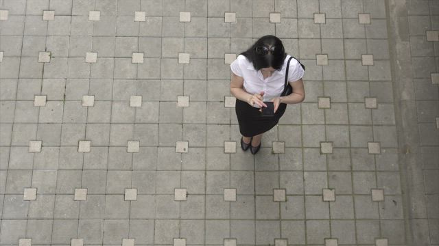 Woman using her smartphone outside.