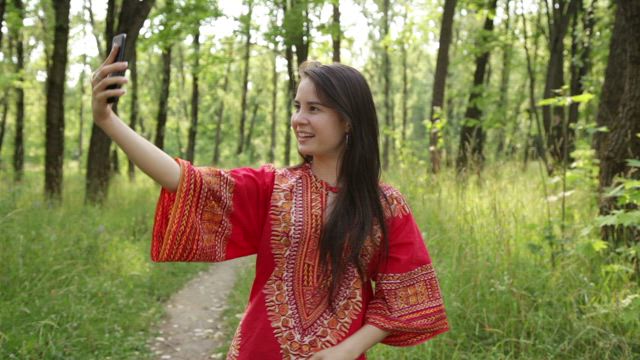Taking a selfie in a forest.
