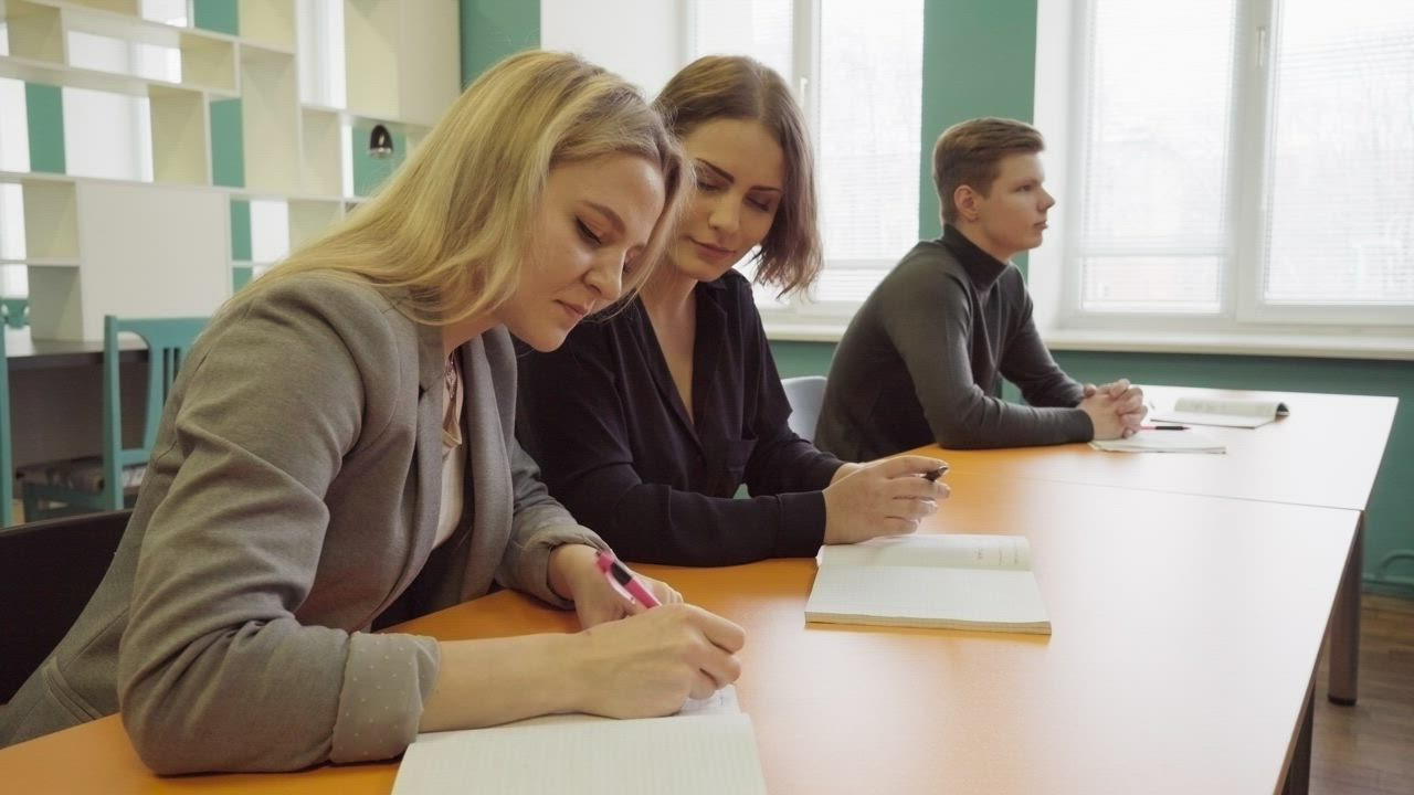 Students sharing notes - Free Stock Video
