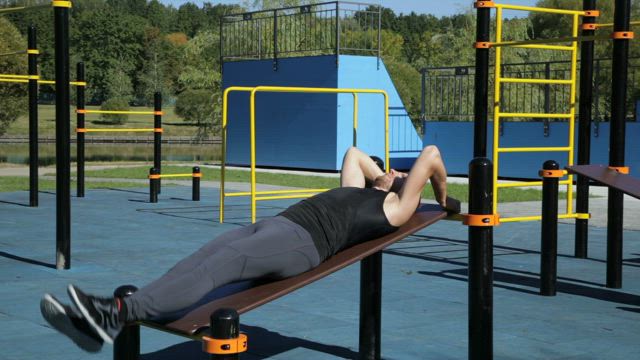 Exercising in an outside gym.