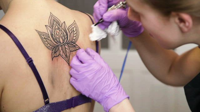 Applying a tattoo.