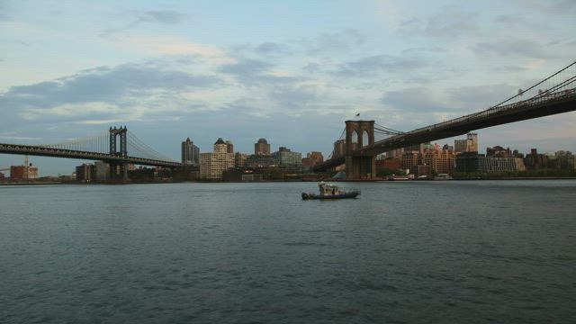 Boat under the Brooklyn bridge.